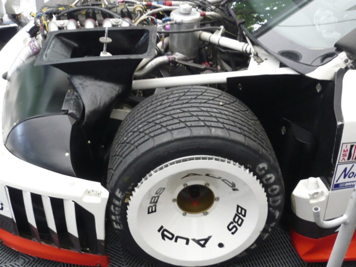 The massive 14' inch wide wheels of Cutaway view of the 1989 Audi IMSA GTO.